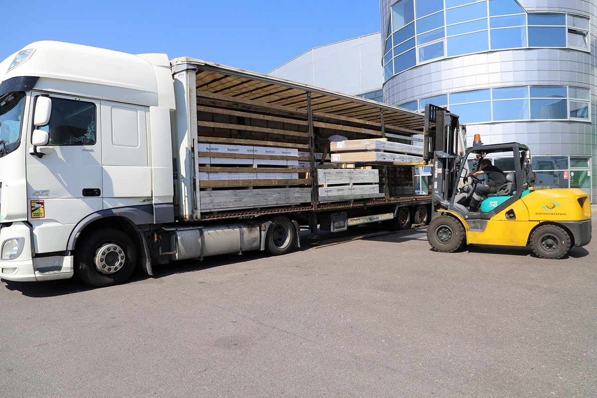 Semi-truck being loaded from the side